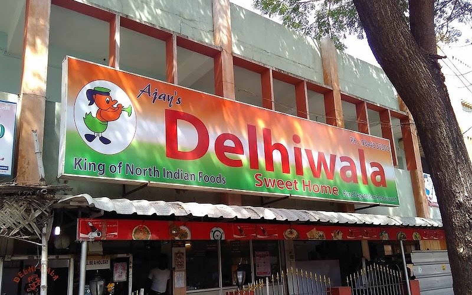Ajay's Delhiwala Sweet Home Coimbatore visiting card