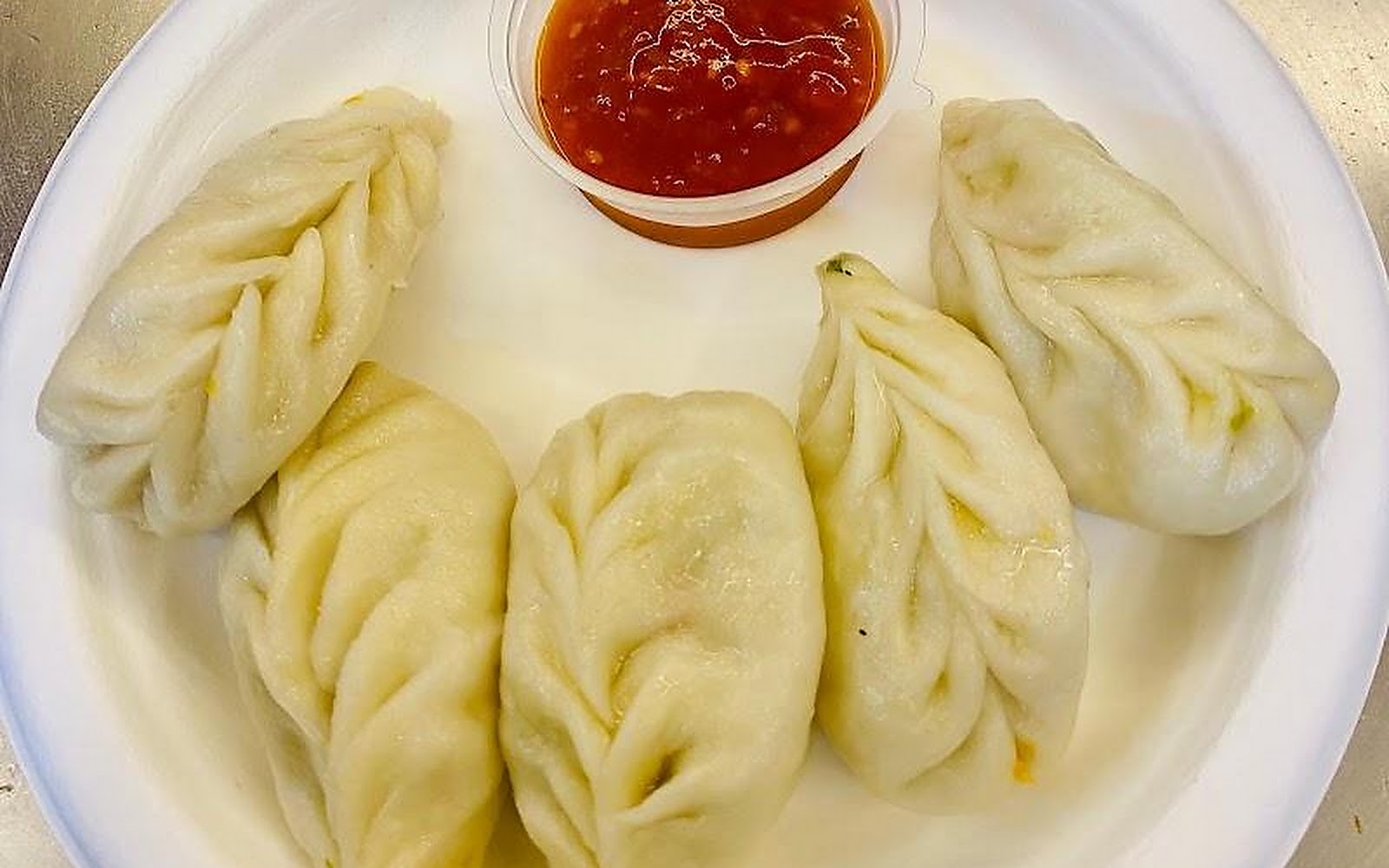 Delicious Momo By My bento box Gaya visiting card