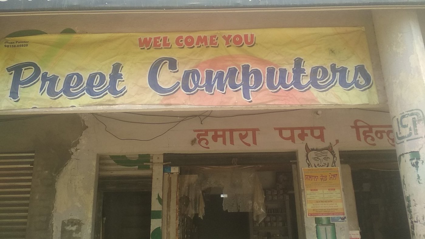Preet Computers and Cctv visiting card