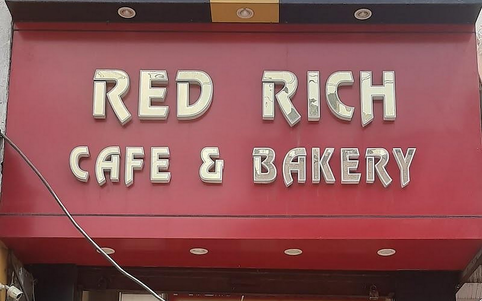 Red Rich Cafe & Bakery Gohana visiting card
